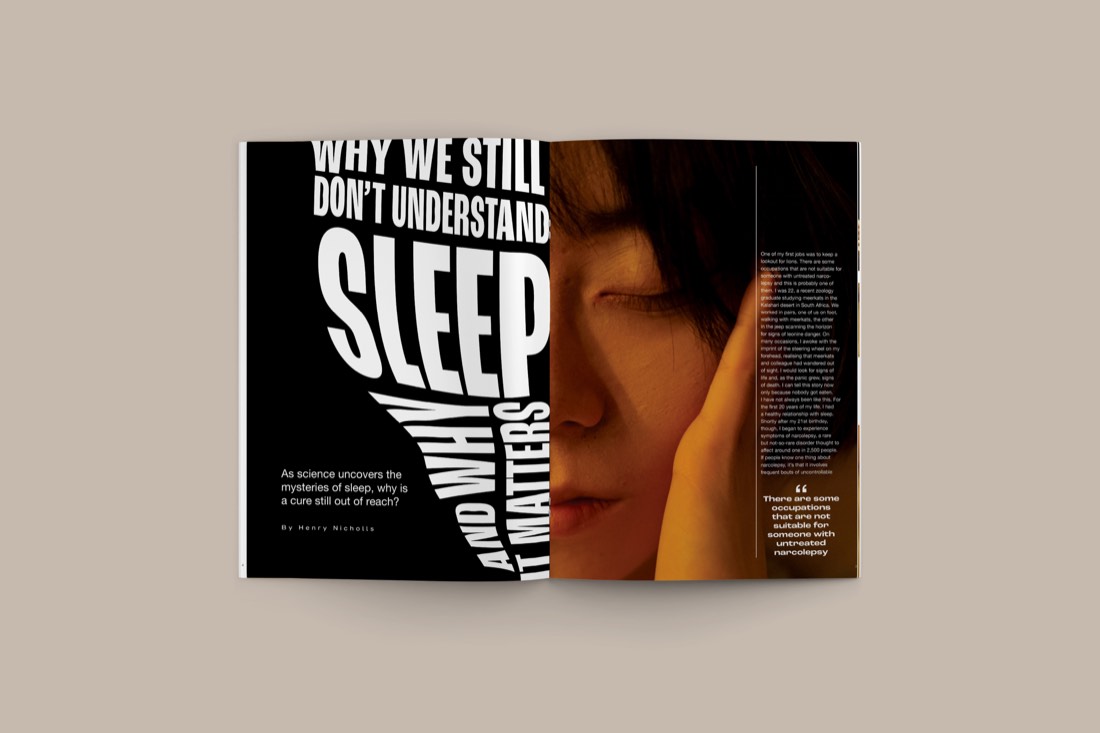 Magazine spread with bold black type over a photo of a person resting