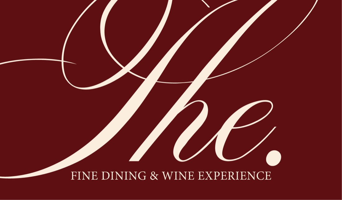 Burgundy logo card reading “The.” fine dining & wine experience